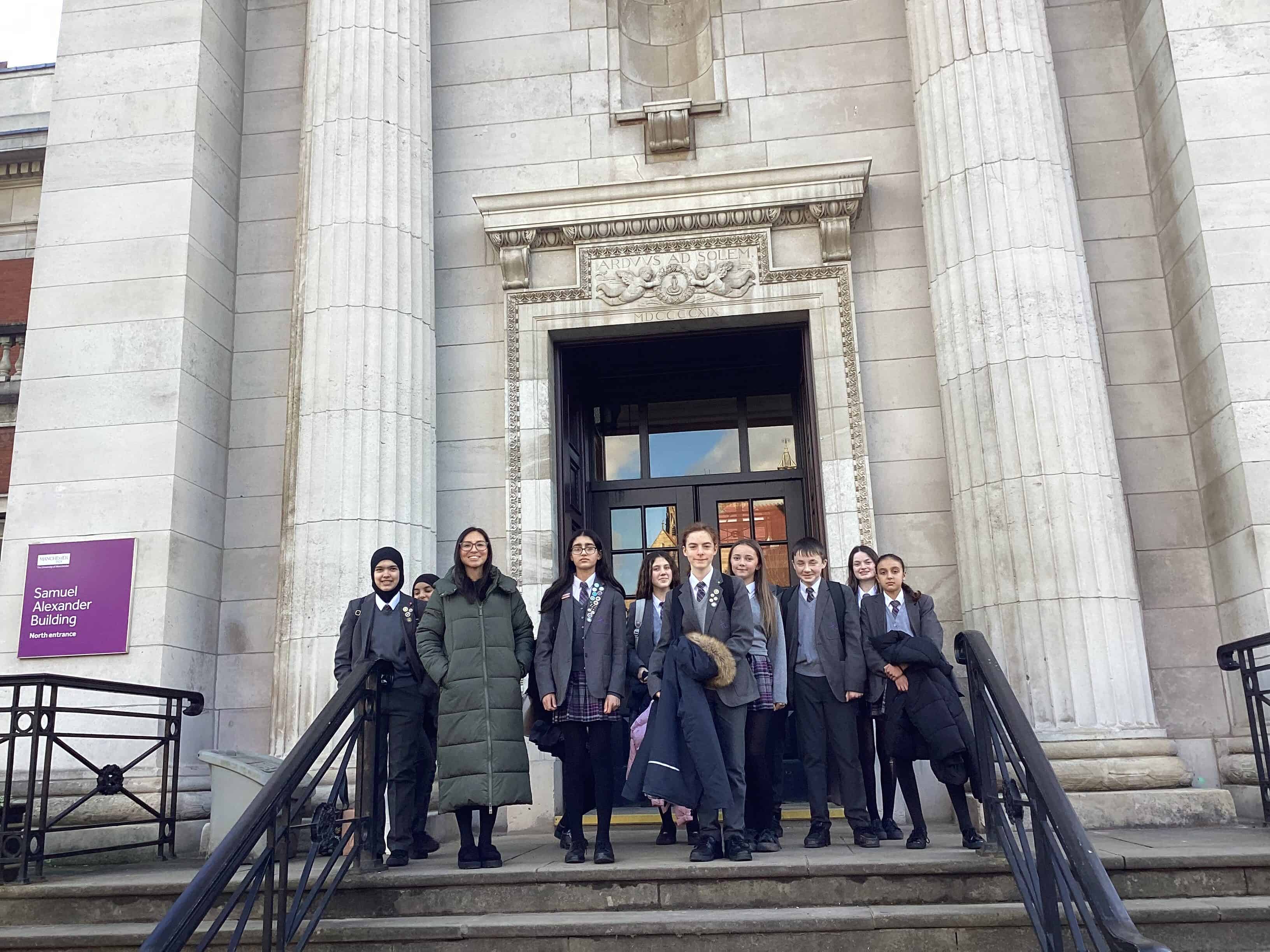 Students from Laurus Cheadle Hulme stand outside of the Samuel Alexander building at the University of Manchester Viva languages day 2024.