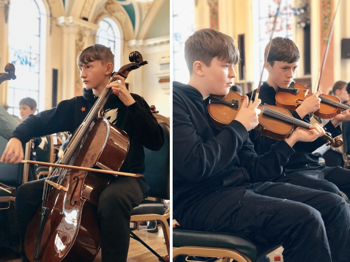 Laurus Cheadle Hulme students play instruments at Benedetti Foundation Strings Day at Stockport Town Hall.